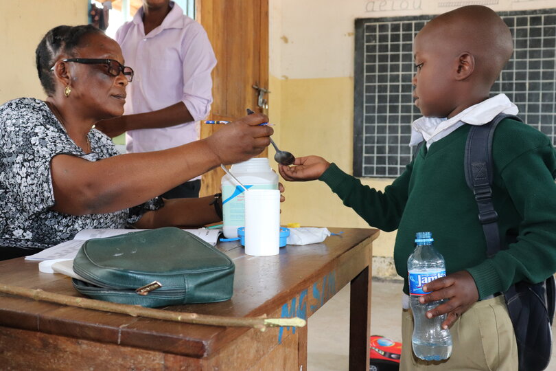 Child receiving treatment. Image copyright Schistosomiasis Control Initiative