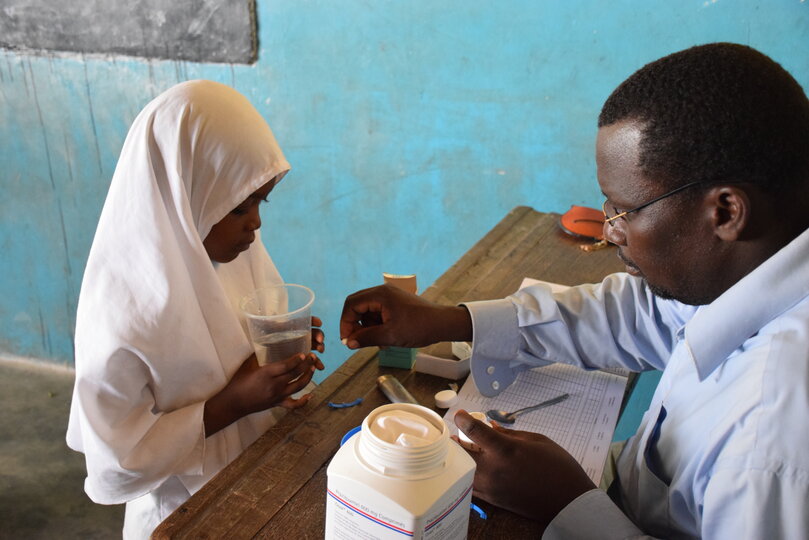 Child receiving treatment in Zanzibar. Image copyright Schistosomiasis Control Initiative