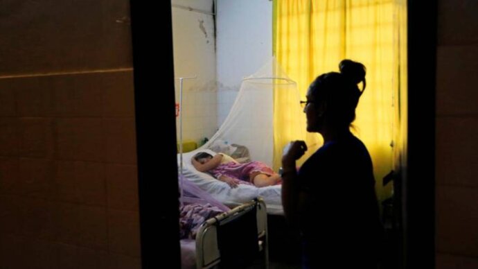 A patient infected with dengue rests while receiving treatment at a hospital in Asuncion, Paraguay January 16, 2020. REUTERS/Jorge Adorno
