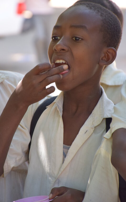 Child taking treatment tablet