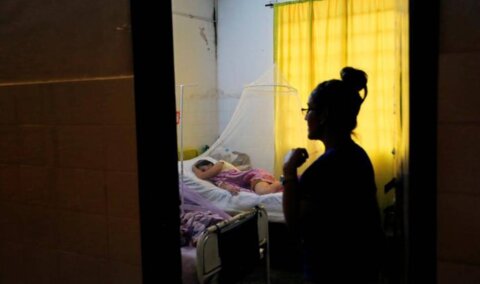 A patient infected with dengue rests while receiving treatment at a hospital in Asuncion, Paraguay January 16, 2020. REUTERS/Jorge Adorno