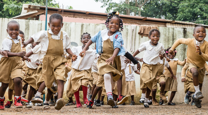 Happy, smiling children running towards the camera